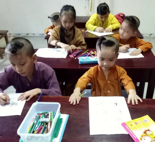 Children studying with new workbooks