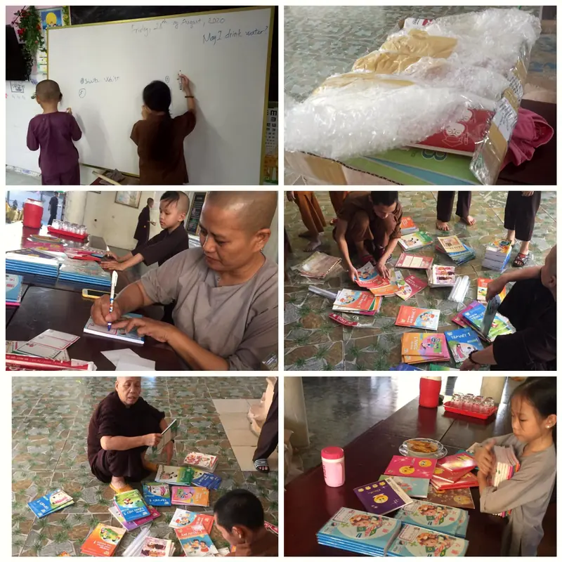 Monks and children open boxes of new books at My Hoa Pagoda